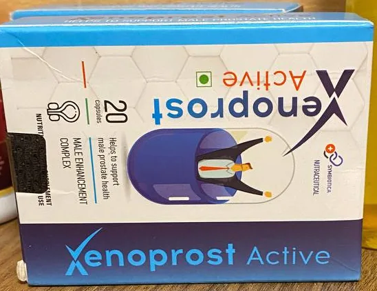 Front of the Xenoprost Active carton standing on a wooden shelf
